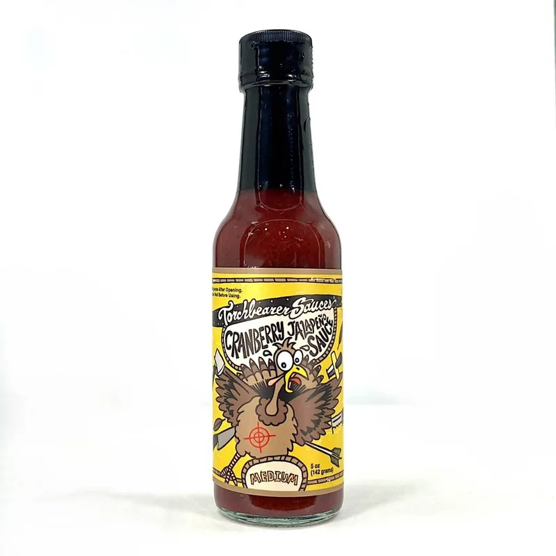 Torchbearer Cranberry Jalapeno Hot Sauce by TorchBearer Sauces hot sauce bottle