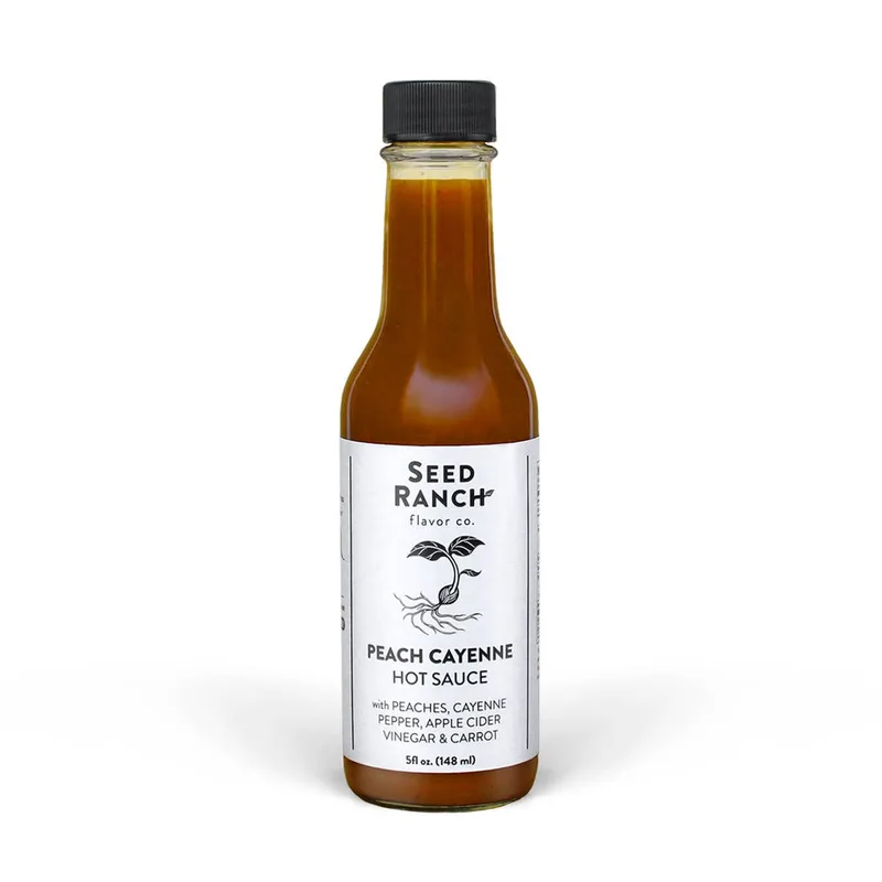 Seed Ranch Peach Cayenne Hot Sauce by Seed Ranch Flavor Co hot sauce bottle